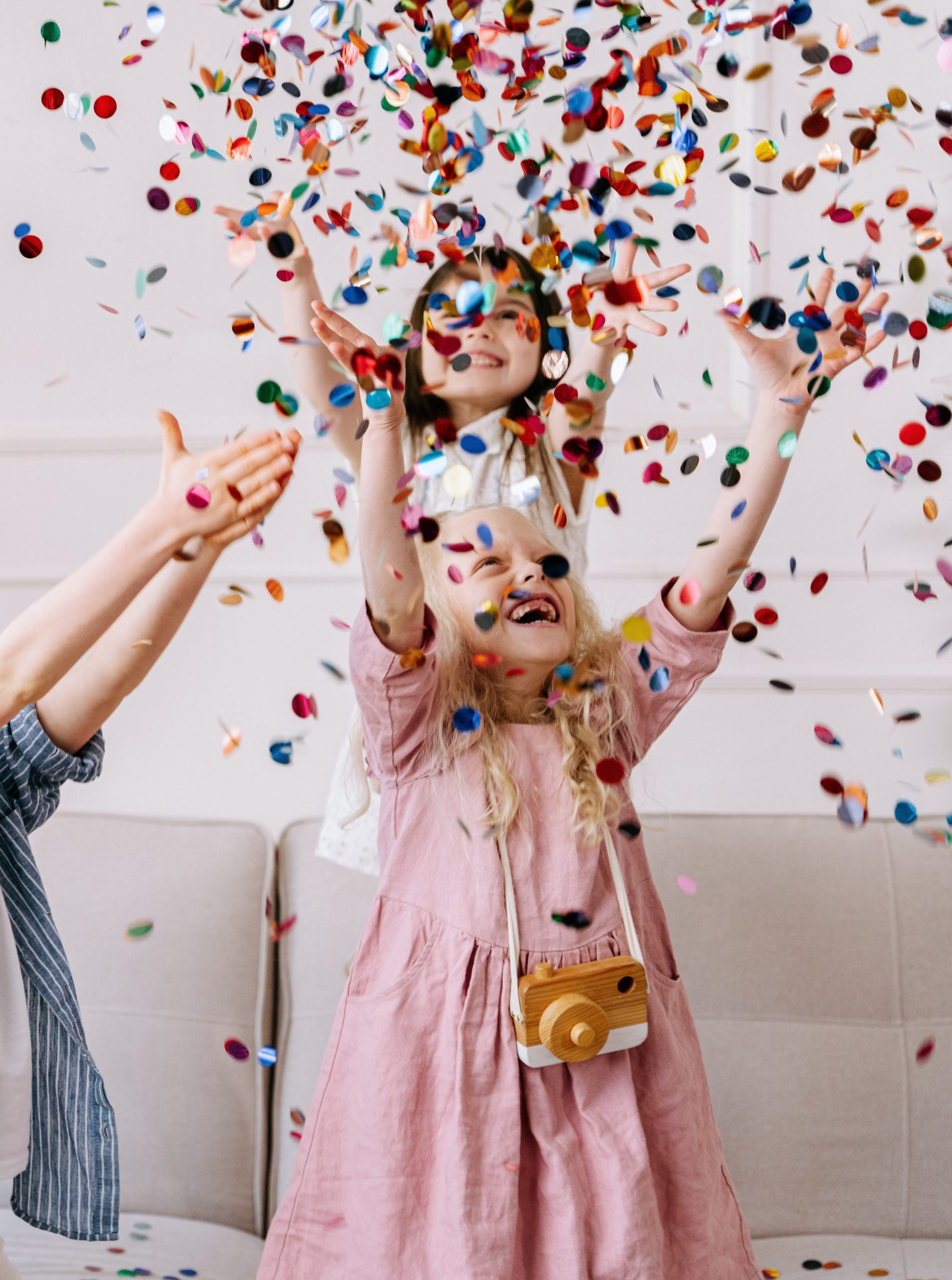 Children playing with confetti